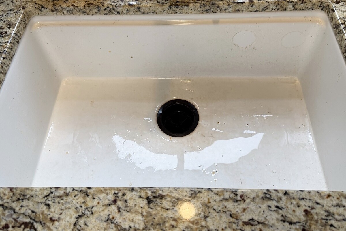 Before: a sink with residue, marks, and buildup